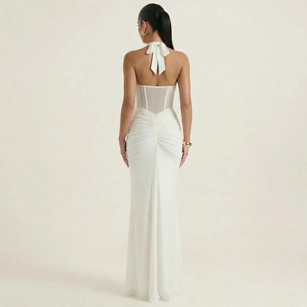 White halter-neck maxi dress, open back with tie bow and ruched fitted skirt