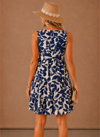 Navy floral sleeveless tiered mini dress, scoop back and layered skirt