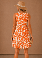 Orange floral sleeveless tiered mini dress, scoop back and layered skirt