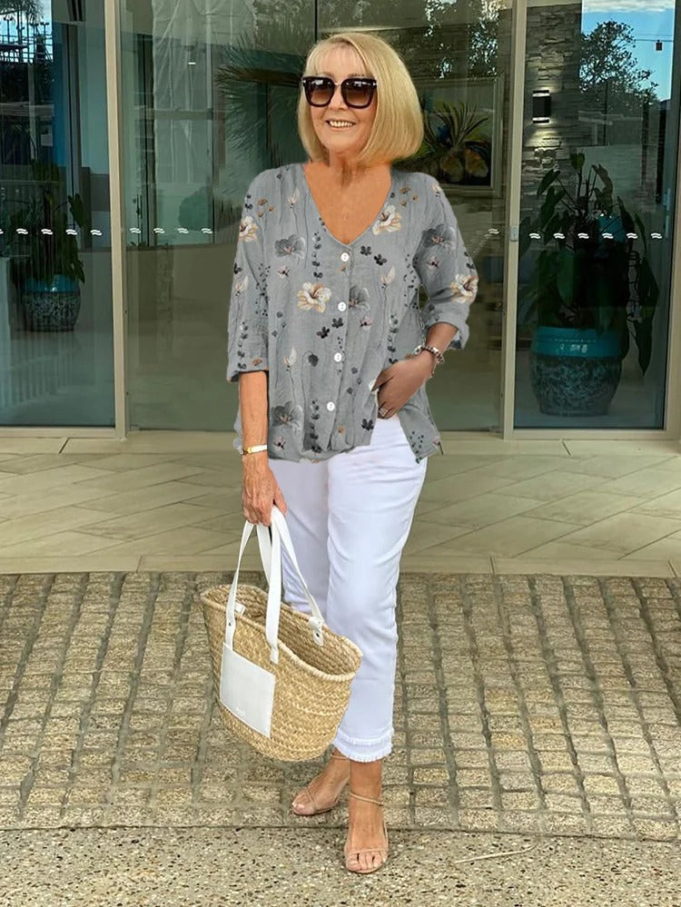 Women's floral V-neck blouse, light grey with blue flowers, three-quarter sleeves and button front