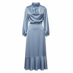 Light blue satin midi dress with long sleeves and high neck, side view.