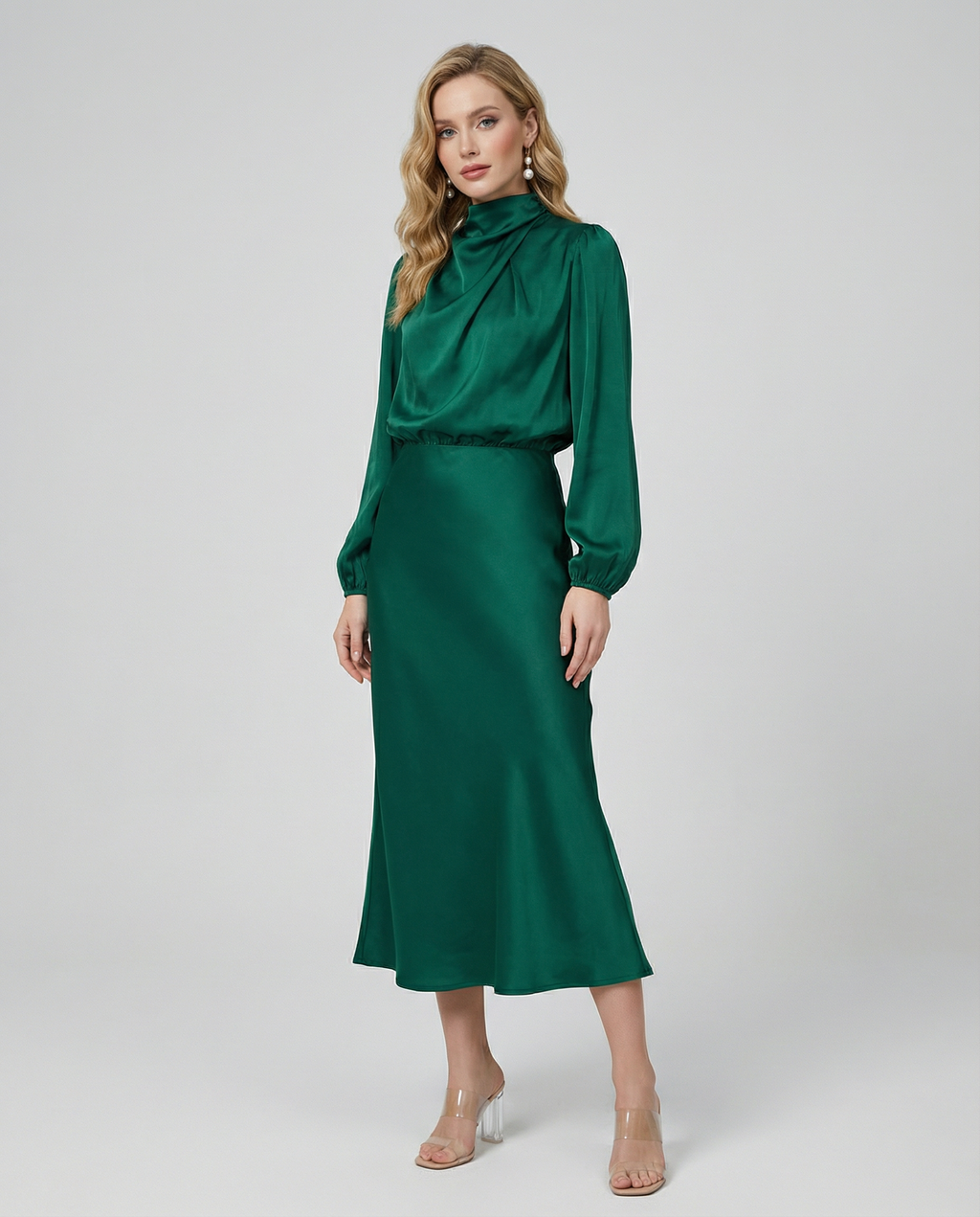 Deep green satin midi dress with long sleeves and high neckline, standing front view.