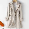Beige belted trench coat, double-breasted front, notched lapels, flap pockets