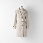 Cream trench coat, double-breasted button front, notched lapels, flap pockets