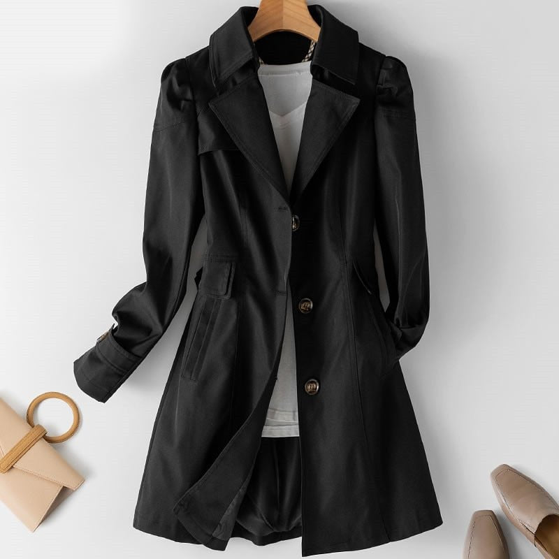 Black belted trench coat, double-breasted button front, flap pockets, wide lapels