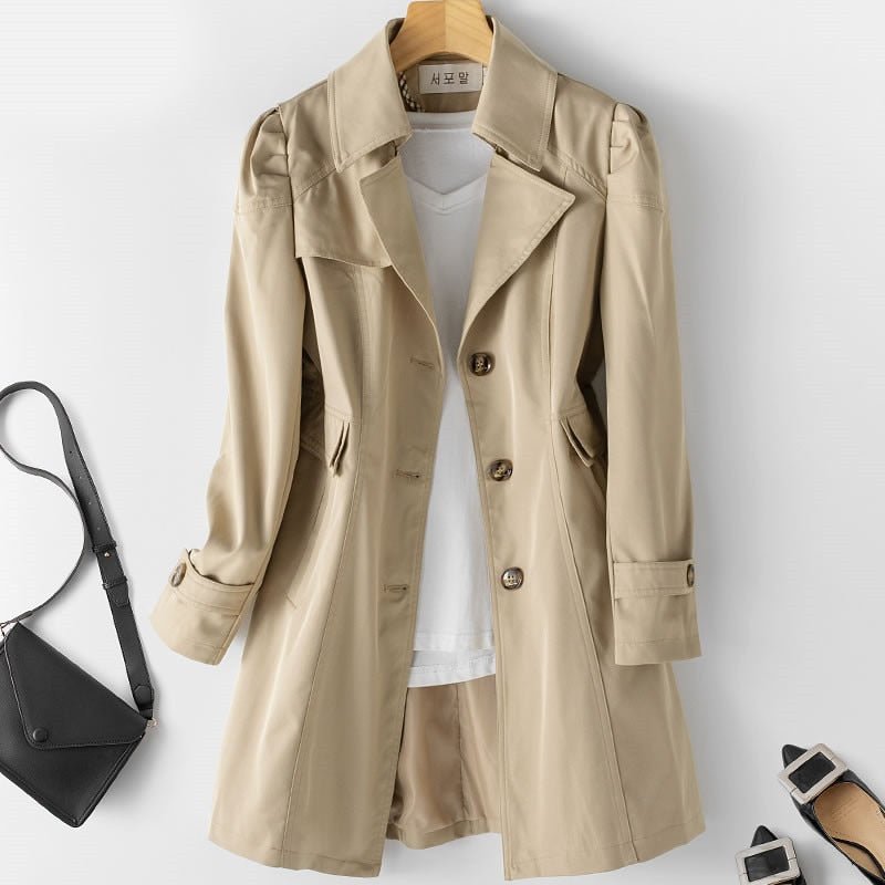 Light khaki belted trench coat, double-breasted button front, flap pockets