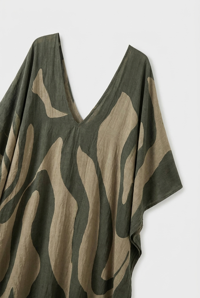 Olive-green oversized kaftan maxi dress with deep V-neck and abstract beige leaf print