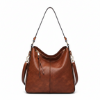Large crossbody zip bag in tan-brown with adjustable strap, top zipper, and zip compartments