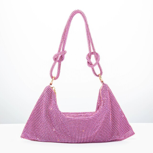 Rose pink glitter shoulder bag with chain handles and wide curved opening.