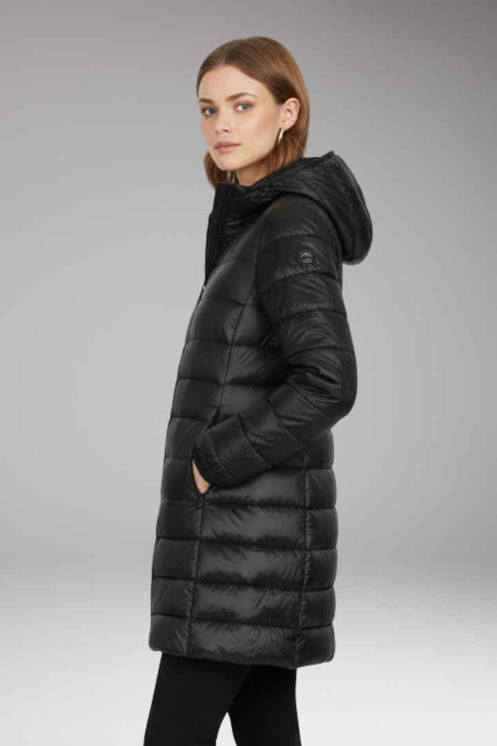 Black long quilted hooded puffer jacket, three-quarter side view with front zipper