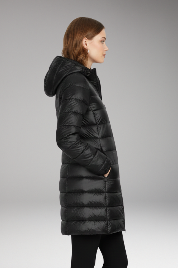 Black long quilted hooded puffer jacket, side profile with hood and front zipper