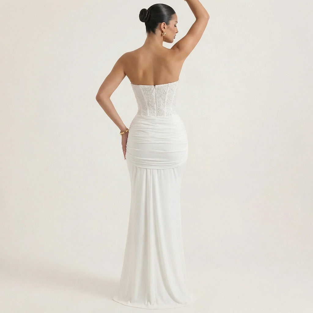White strapless sequin maxi evening gown with ruched bodice and draped skirt (side view)