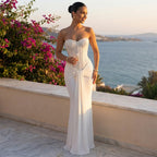 White strapless sequin maxi evening gown with fitted waist ruching and flowing skirt