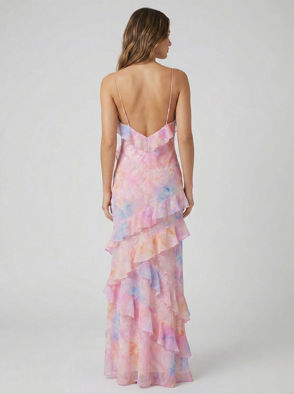 Pink pastel chiffon maxi dress with open-back V straps and tiered ruffle skirt