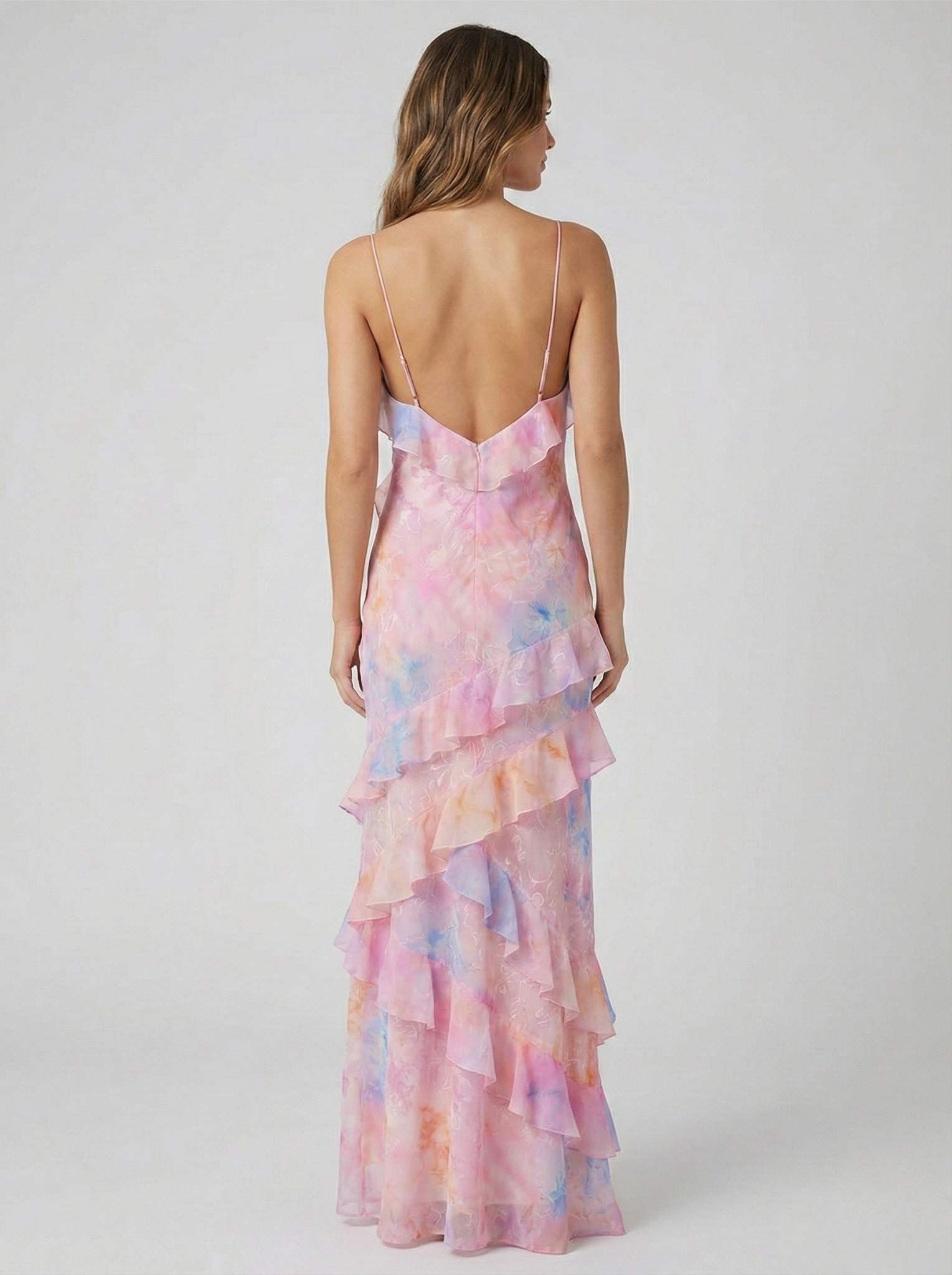 Pink pastel chiffon maxi dress with open-back V straps and tiered ruffle skirt