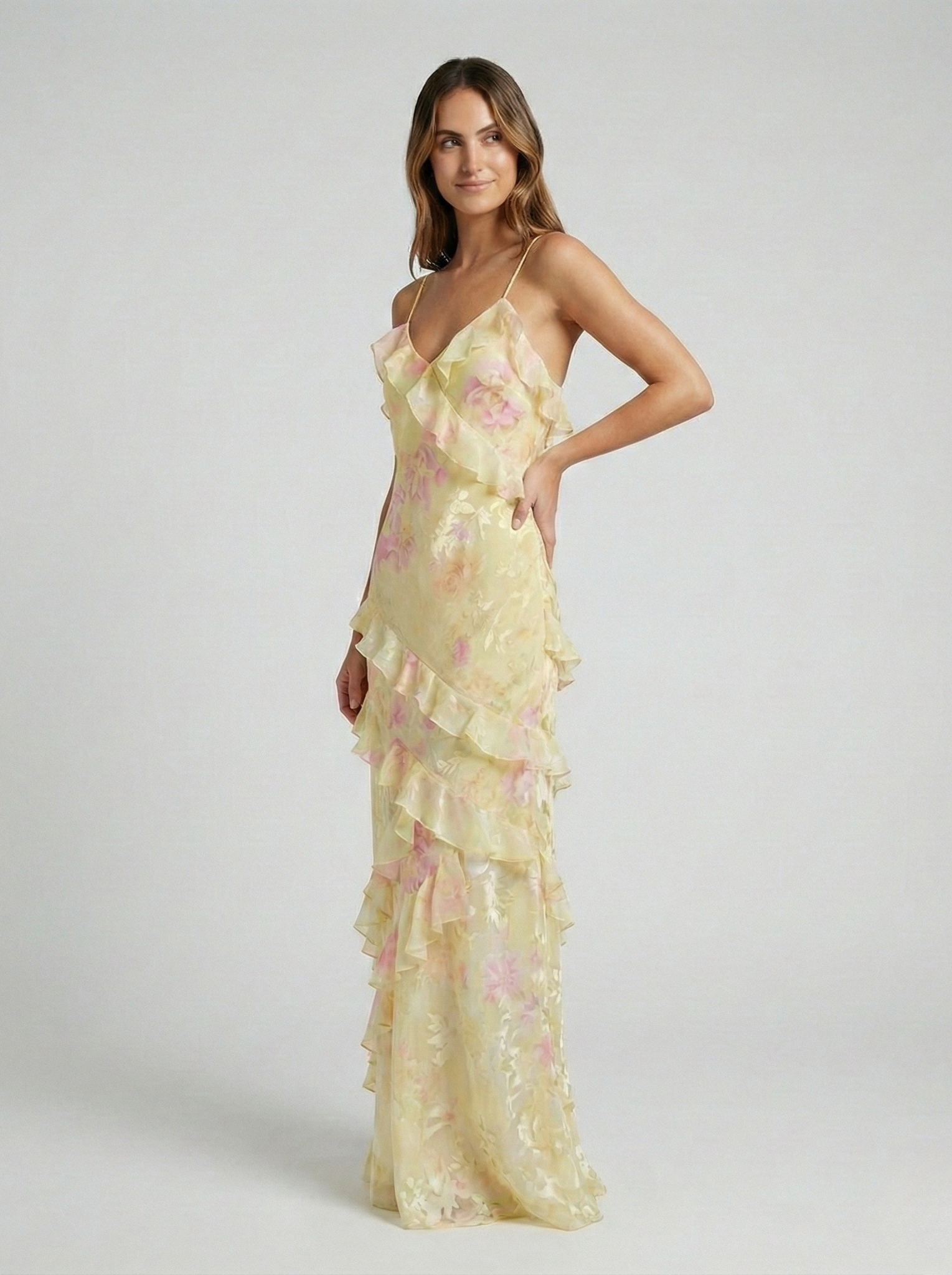 Yellow chiffon maxi dress with tiered ruffle skirt and thin spaghetti straps