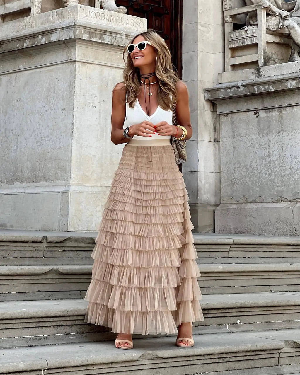Beige tiered maxi skirt with high waist and flowing ruffle layers