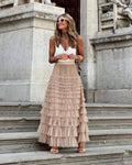 Beige tiered maxi skirt with high waist and flowing ruffle layers