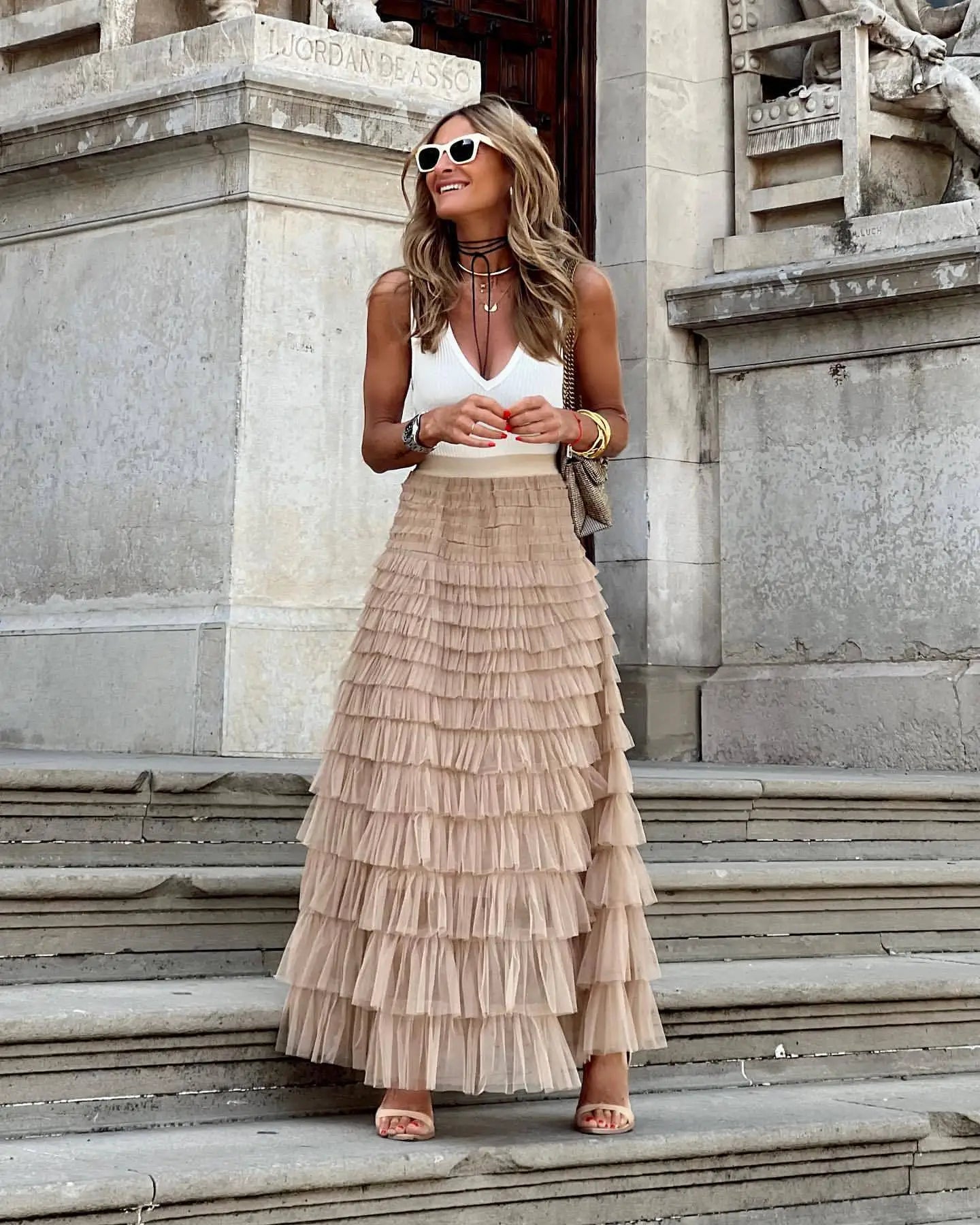 Beige tiered maxi skirt with high waist and flowing ruffle layers