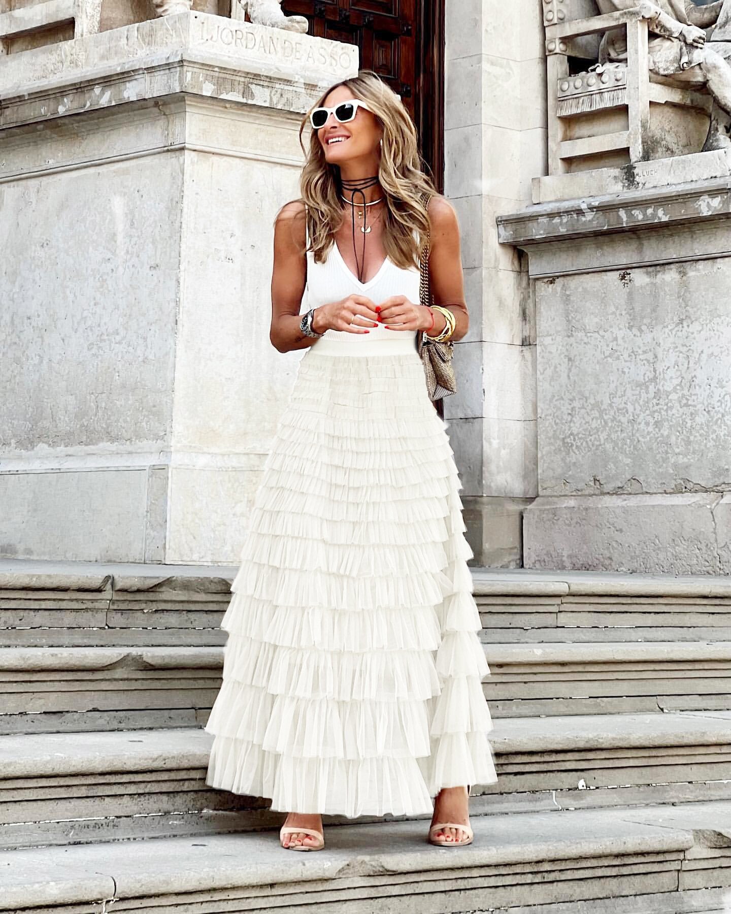 White tiered maxi skirt with high waist and flowing ruffle layers