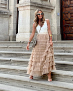 Light beige tiered maxi skirt with layered ruffles and high waist