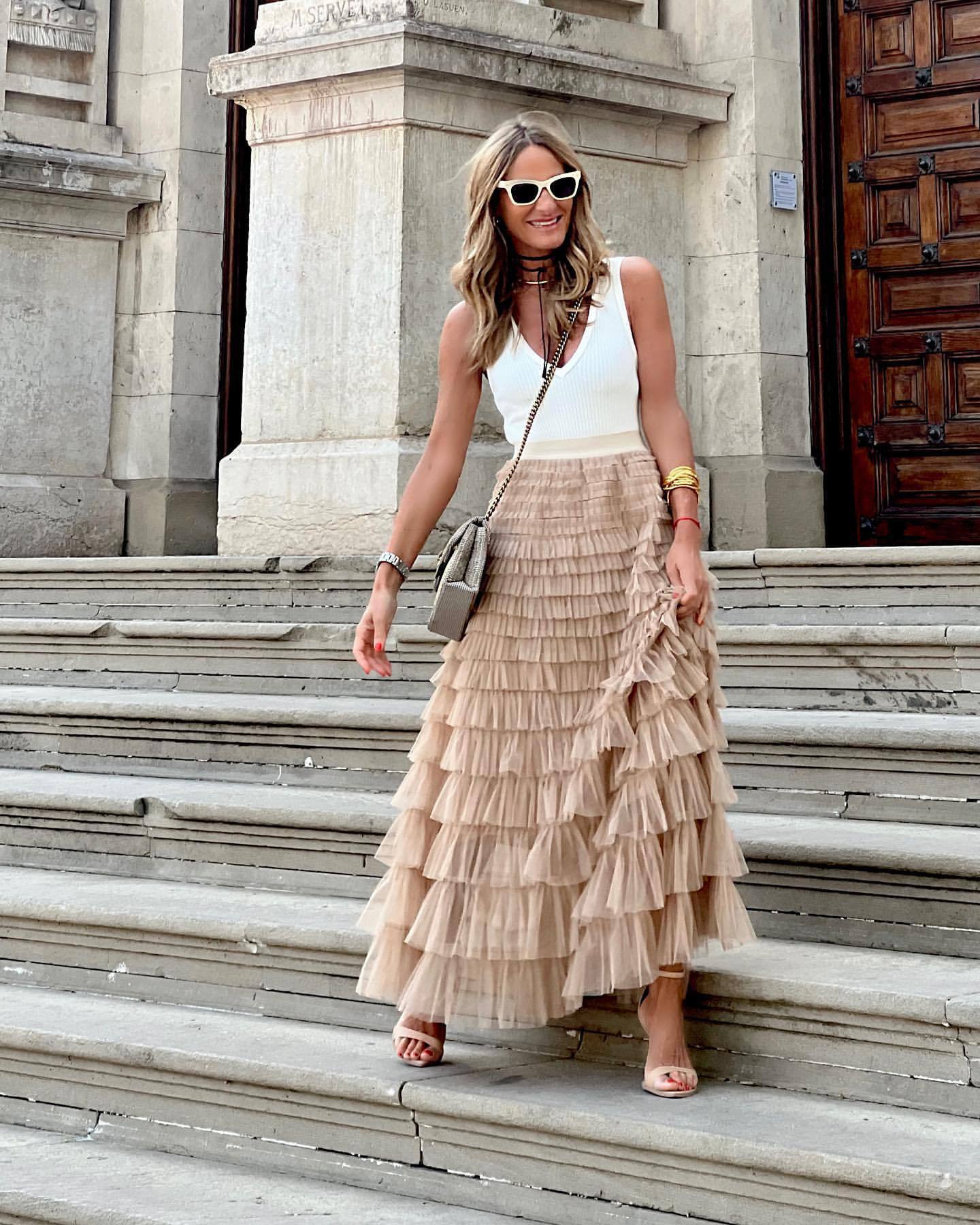 Light beige tiered maxi skirt with layered ruffles and high waist