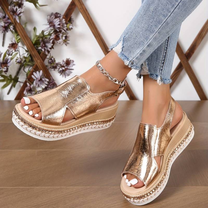 Gold metallic peep-toe wedge platform sandals with cutout upper and chain ankle strap