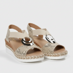 Beige espadrille platform sandals with open toe, elastic strap and silver ring detail