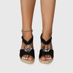 Black espadrille platform sandals with open toe and silver ring detail, ankle strap