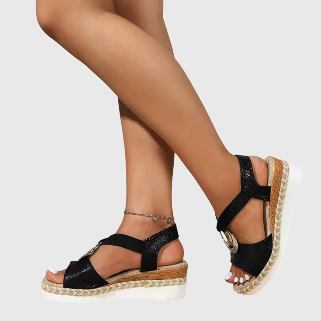Black espadrille platform sandals with open toe, silver ring detail and wide ankle strap
