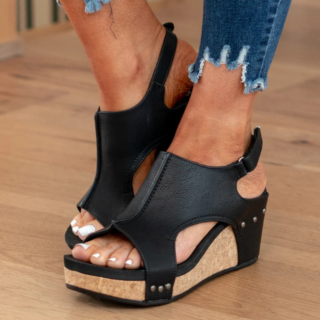 Black studded wedge sandals with cut-out upper, slingback strap, platform sole