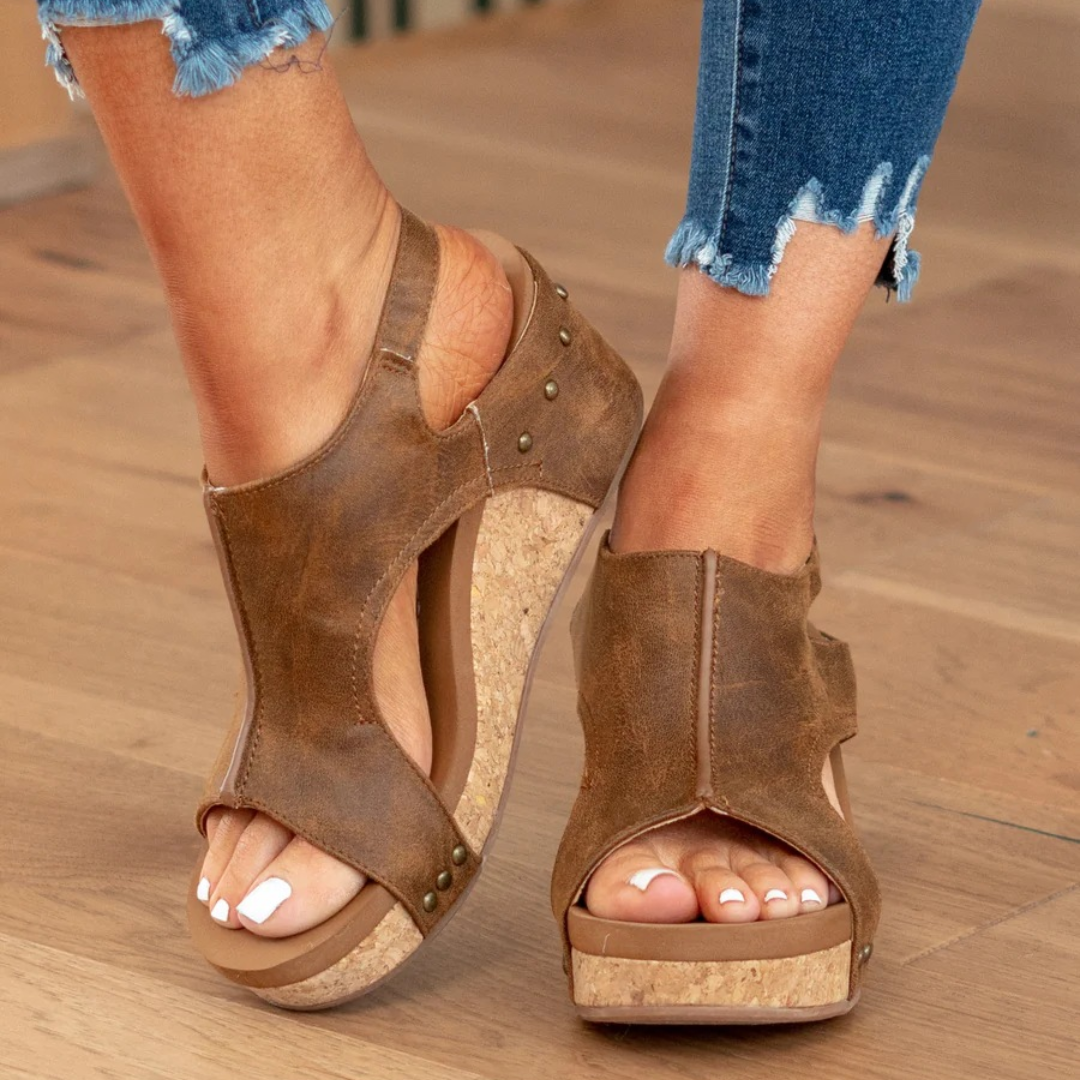 Brown studded platform wedge sandals with cut-out upper and slingback ankle strap