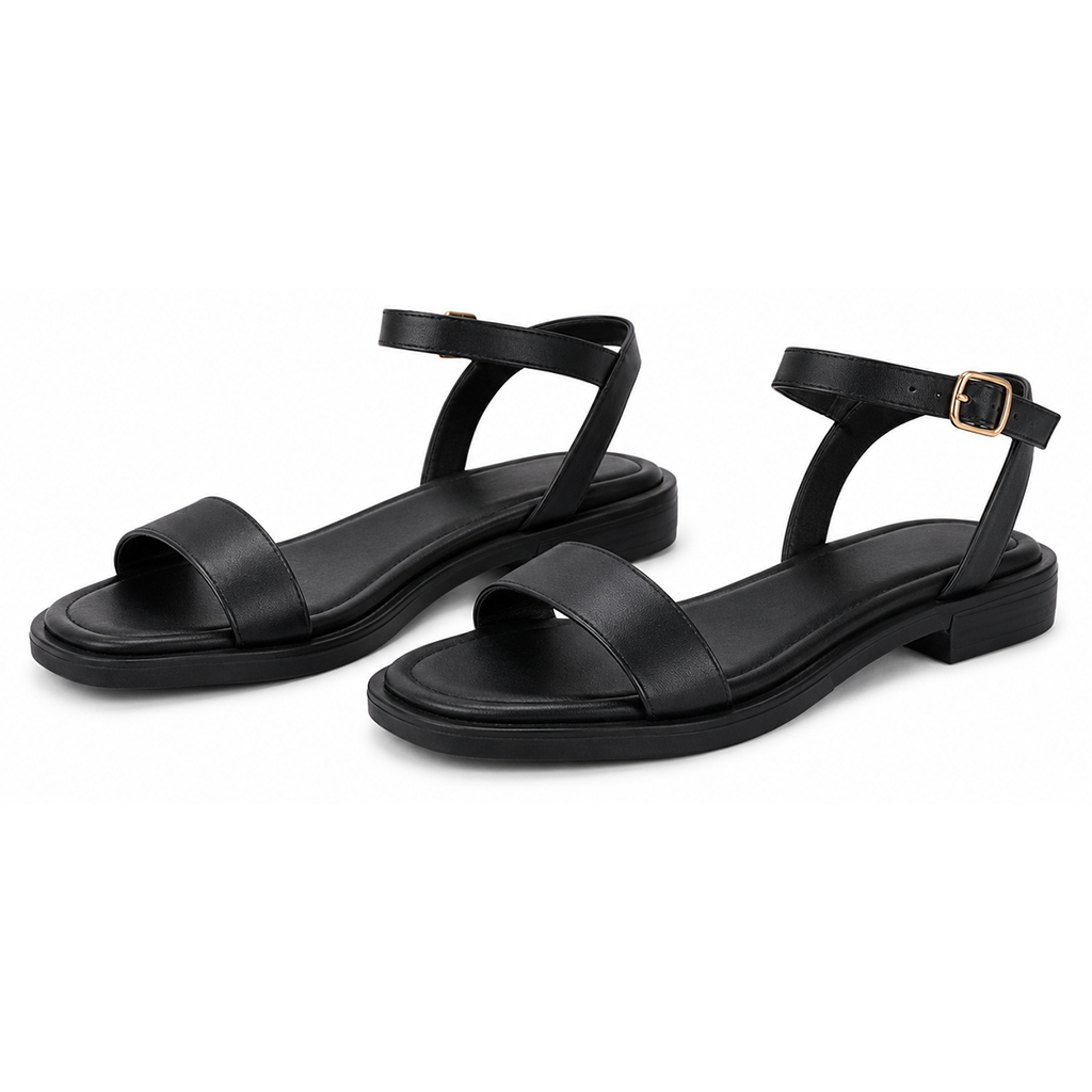 Pair of women's black flat sandals with ankle straps and gold buckle details