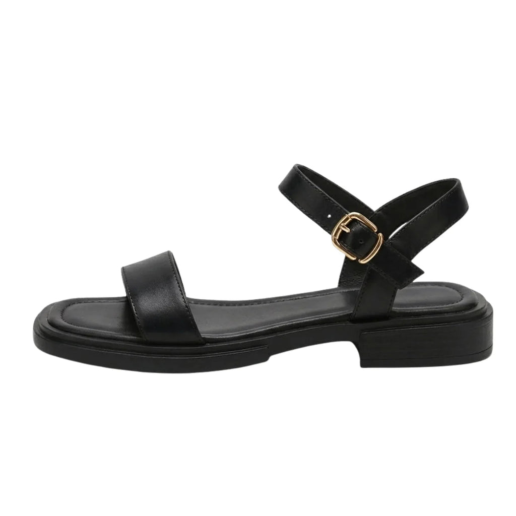 Women's black ankle-strap flat sandals with wide toe strap and gold buckle