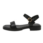 Women's black ankle-strap flat sandals with wide toe strap and gold buckle