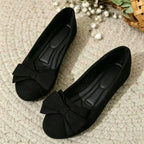 Wide-fit cushioned ballet flats, black faux suede, bow detail, pair on rug