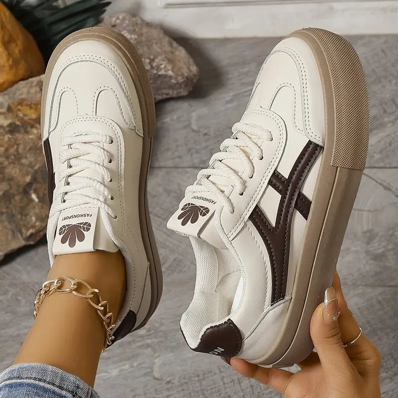 Women’s platform sneakers, white uppers with dark brown side stripes and lace-up front