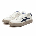 White platform sneakers with blue stripes, lace-up cushioned sole