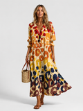 Multicolor printed shirt dress with button front, V-neck, and tiered relaxed skirt
