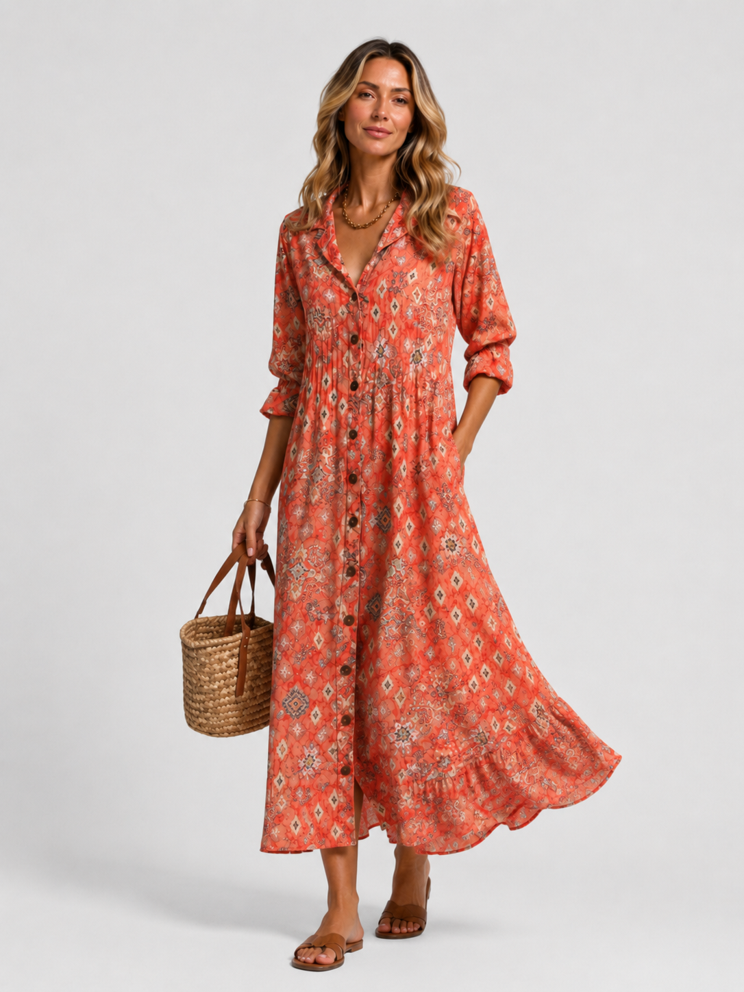 Coral orange printed shirt dress with V-neck buttons and relaxed midi-length skirt