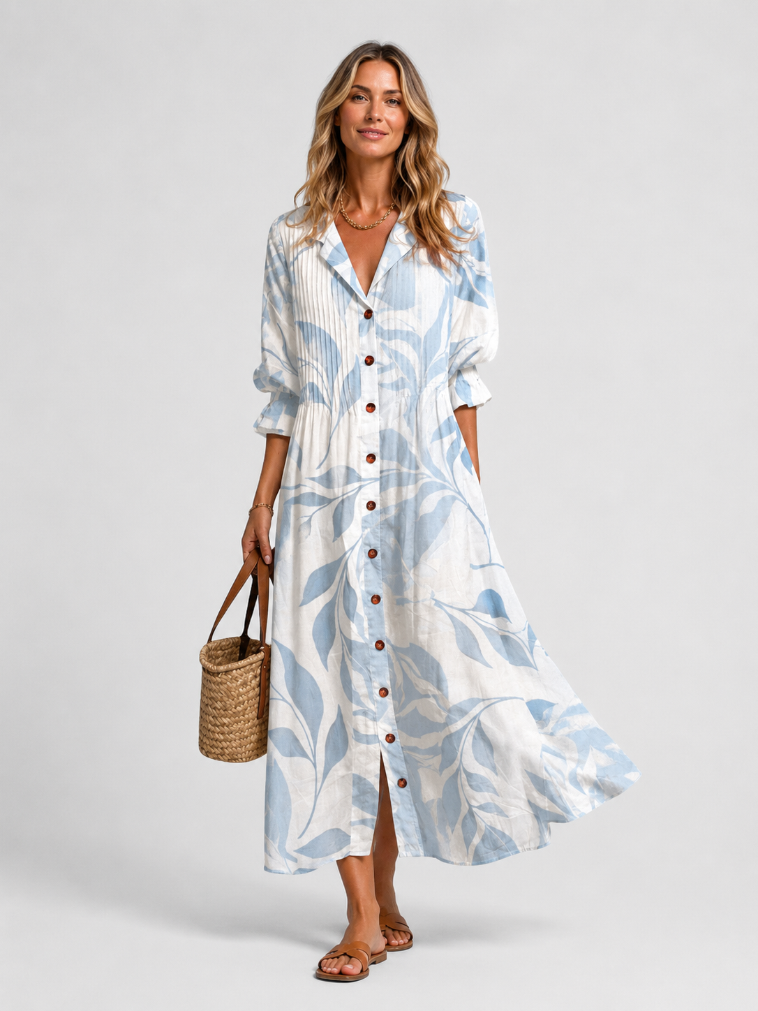 Light blue and white printed shirt dress with button front, V-neck, and relaxed midi hem
