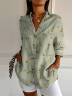 Printed split-neck blouse with button front, green floral, rolled sleeves