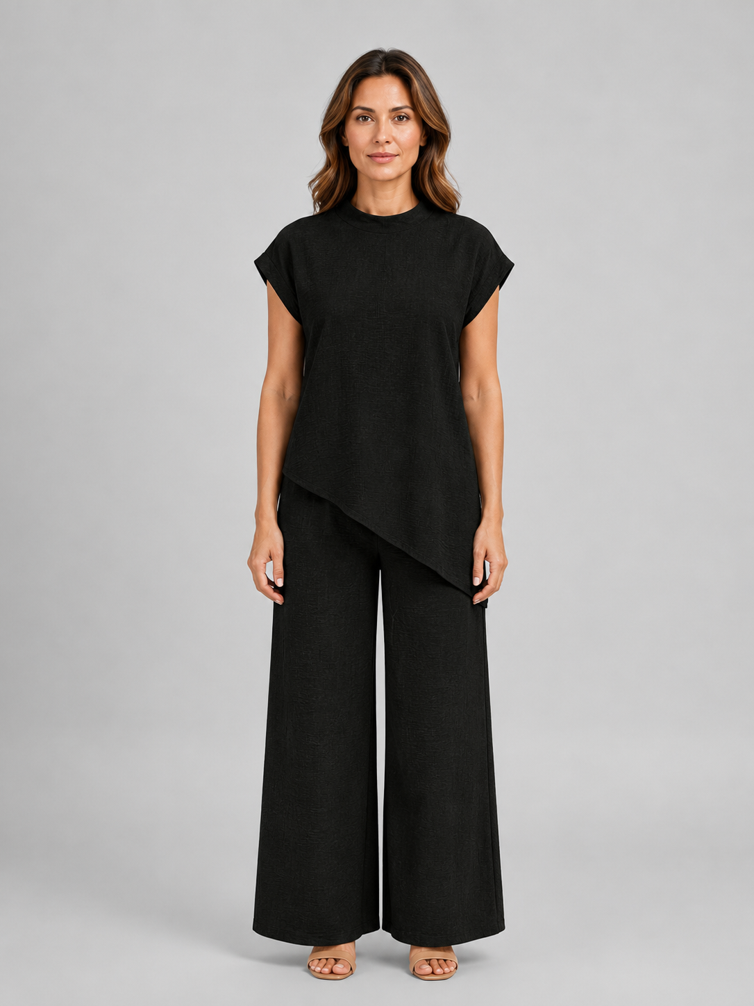 Women's relaxed co-ord set in black: asymmetric top with layered hem and wide-leg trousers