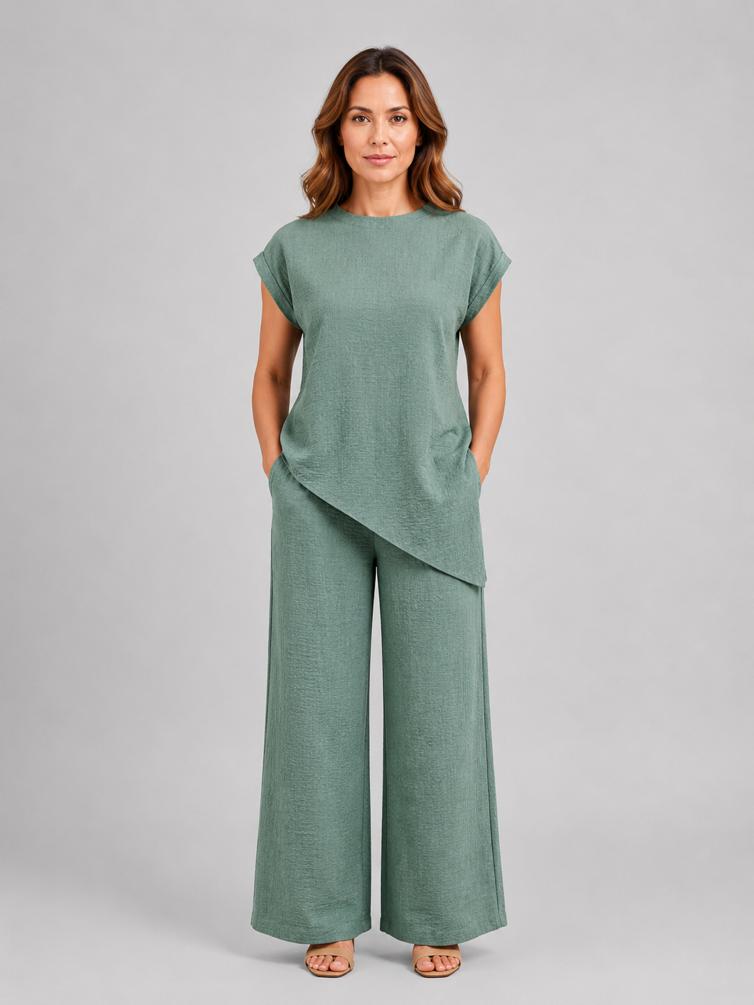 Women's relaxed co-ord set in sage green: asymmetric sleeveless top and wide-leg trousers