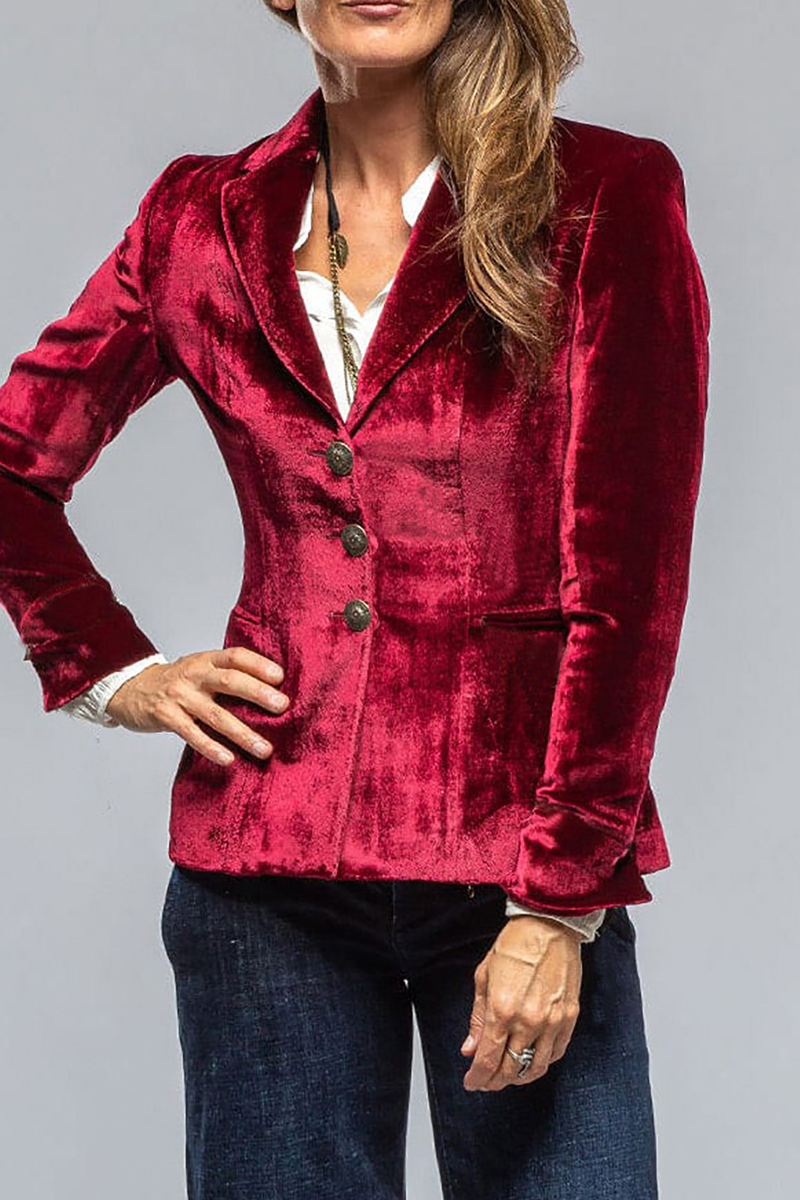 Dark red notch lapel blazer with flap pockets, three-button front, flared hem