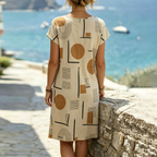Beige shift mini dress, short sleeves, round neck; abstract geometric pattern (back)