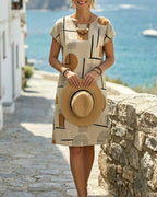 Beige abstract geometric shift mini dress with round neck and short sleeves