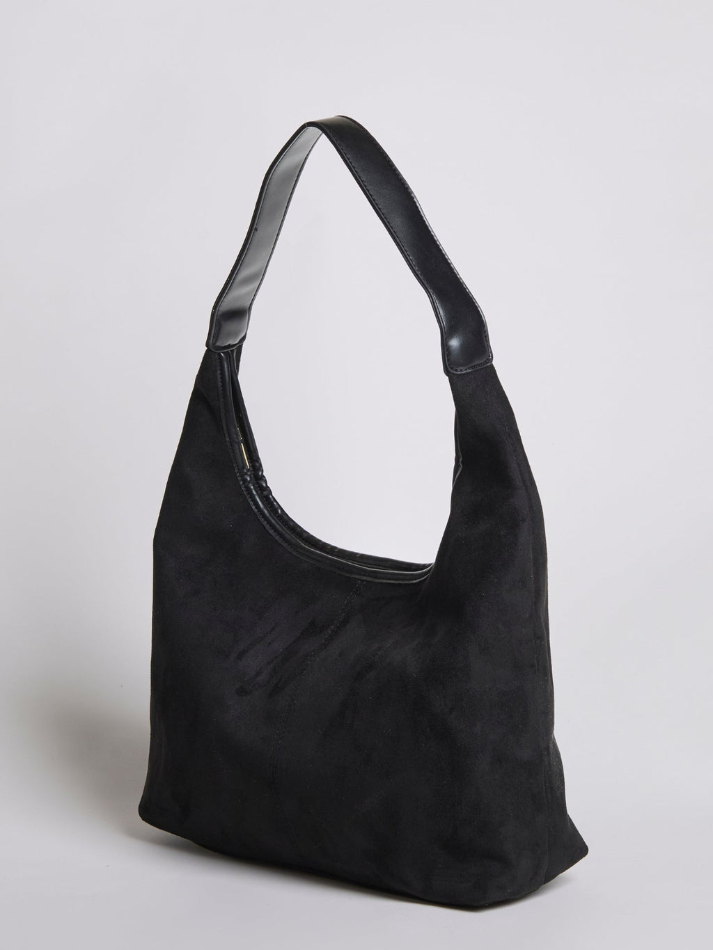 Black shoulder bag with top zipper, curved handle, and front seam panel