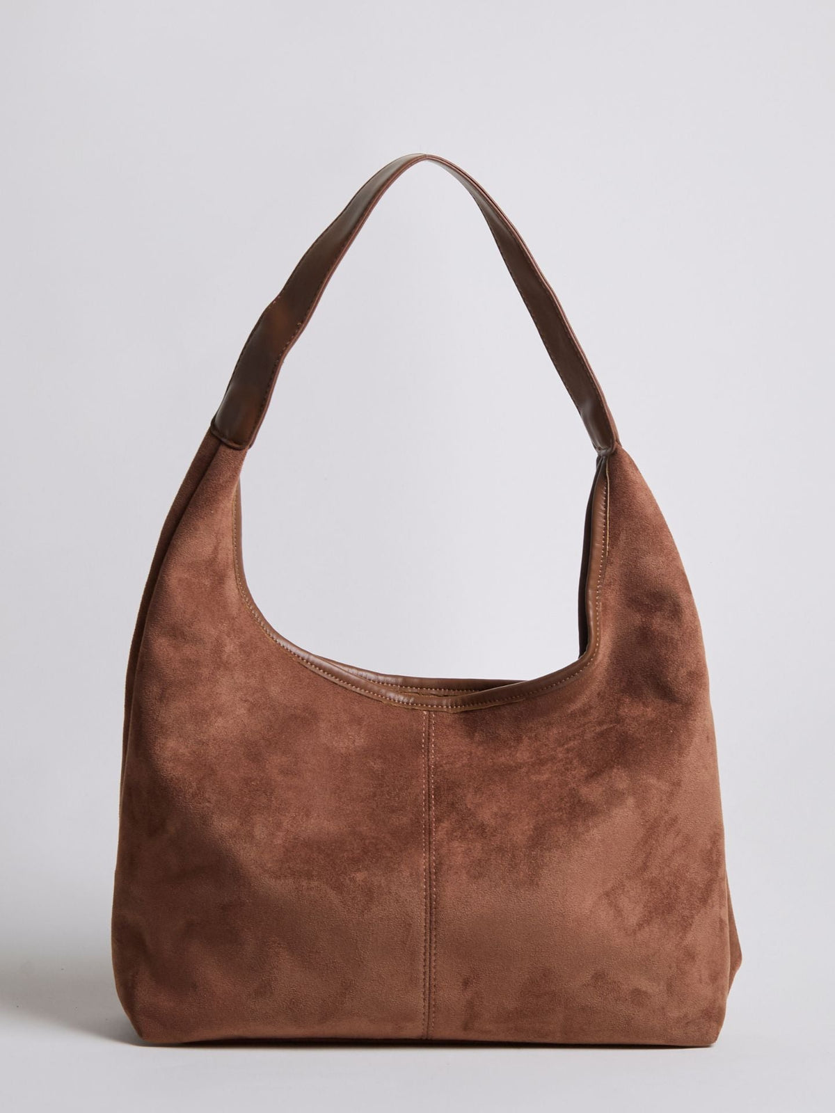 Caramel brown suede shoulder bag with top zipper and curved handle