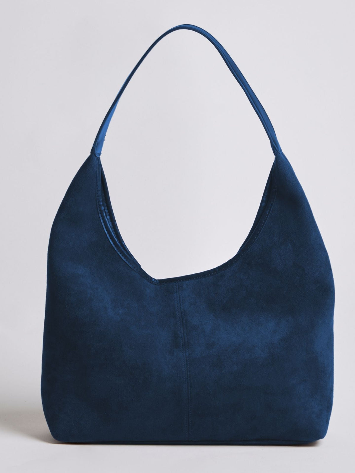 Navy blue suede shoulder bag with top zipper and curved top handle